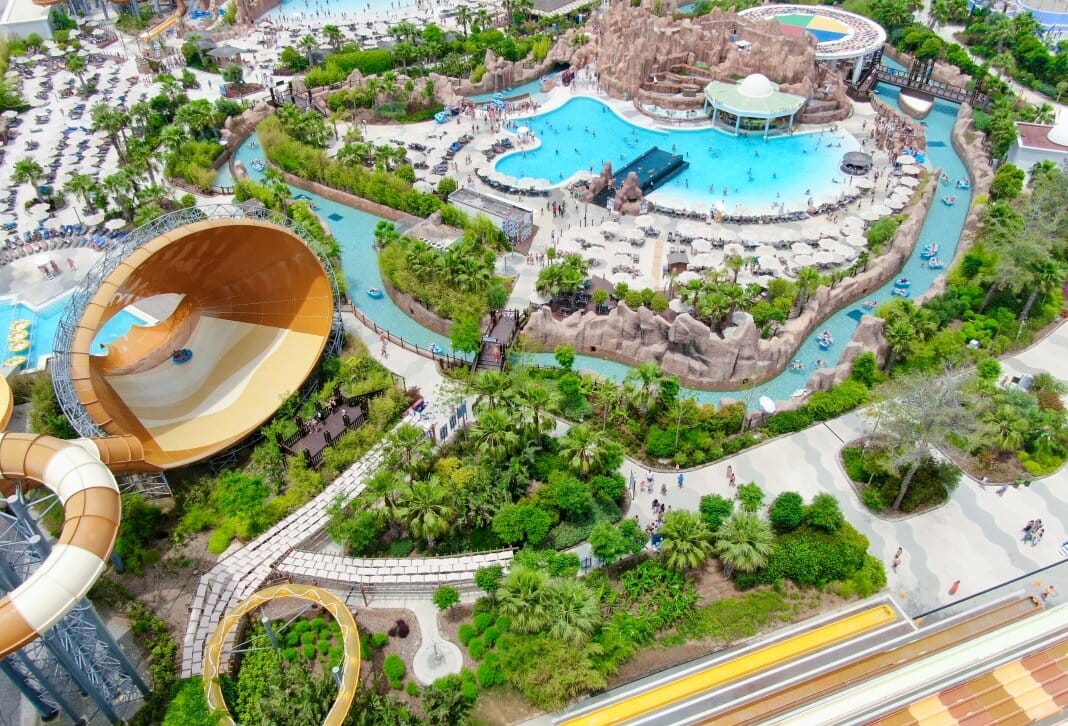 Aerial view of The Land of Legends water park with massive slide, wave pool, and lazy river